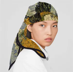 Detail of artistic Van Gogh style silk scarf worn as a stylish headband hair accessory