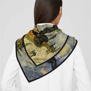 Detail of Van Gogh oil painting style silk scarf worn over a white suit blazer