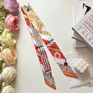 Detailed view of long silk twilly scarf with equestrian horse print and vibrant patterns