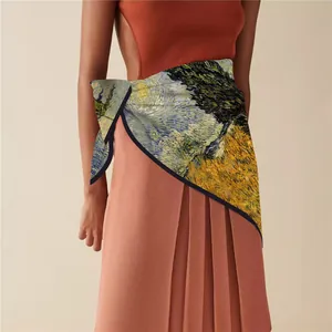 Detail of multi-functional Van Gogh Starry Night print shawl styled on a pleated skirt