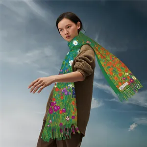 Green cashmere pashmina scarf with colorful floral print and elegant fringe detail