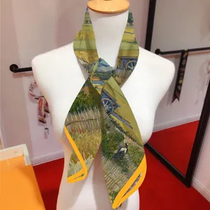 Detail view of the Van Gogh Harvest oil painting print on a yellow twilly silk scarf