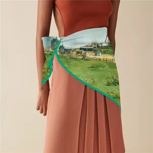 Detailed shot of an artistic oil painting silk scarf styled on a model as an elegant waist belt