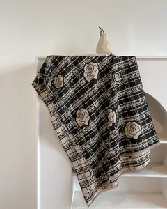 Elegant black and beige camellia floral shawl with classic checkered pattern and fringe