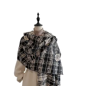 Elegant knit shawl with black and white grid pattern and large rose floral embroidery