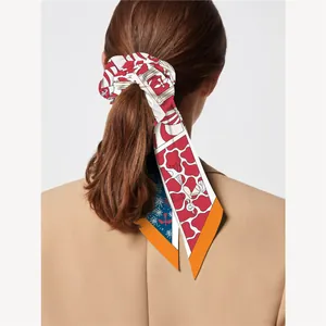 Coletero elegante de seda con lazo estampado geométrico multicolor para coleta de mujer