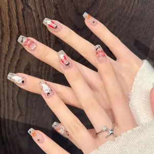 Halloween press-on nails featuring pumpkin, ghost and spider hand-painted patterns