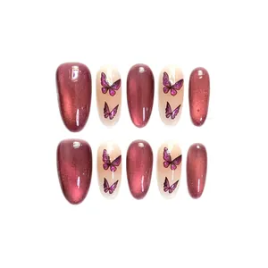 Uñas postizas hechas a mano ojo de gato rojo rosa con diseños de mariposas y brillo