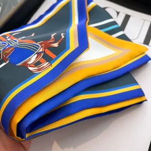 Retro equestrian horse print silk scarf with luxury blue and gold patterns on Vogue magazine