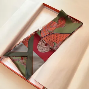 Polished silk-texture scarf with vibrant artistic patterns in premium gift packaging