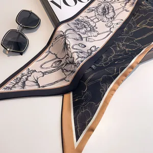 Elegant double-sided floral silk twilly scarf with poppy pattern and luxury fashion magazine