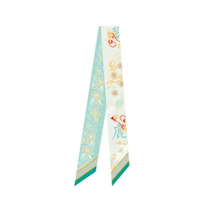 Detail showing Dunhuang silk scarf with golden floral patterns and traditional deer motif