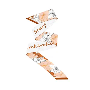 Detail view of floral silk scarf with orange lilies and wave patterns on apricot base
