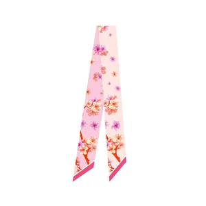 Close-up of Dunhuang style silk twilly scarf with pink cherry blossom floral print
