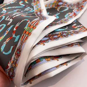 Detail of baroque art print silk scarf with luxury grey pattern and satin texture