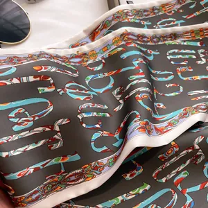 Detail of artistic print silk scarf with abstract patterns and fluid texture