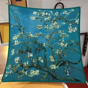Detail view of square silk scarf featuring Van Gogh's Almond Blossoms with blue borders