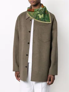Detailed view of art oil painting scarf with butterfly and plant patterns on shirt
