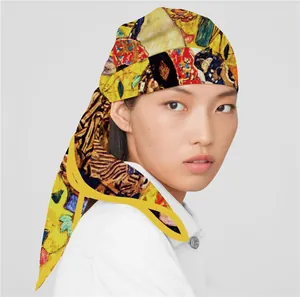 Detail showing an artistic Van Gogh style silk scarf worn as a stylish headscarf