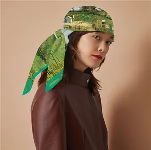 Detail of silk scarf with Van Gogh oil painting print paired with brown leather jacket