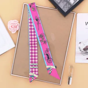 Close-up of elegant twilly scarf with carriage pattern and checkered design for handbags
