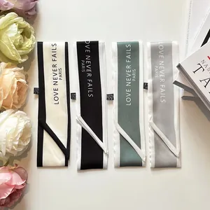 Satin bag handle ribbons in four colors with Love Never Fails Paris print and floral decor