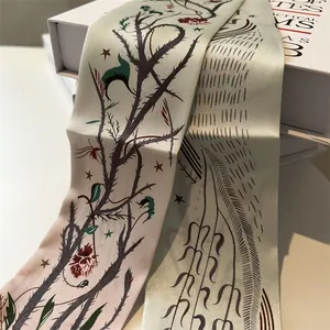 Detail of silk twilly scarf with elegant vintage floral and thorn print textures