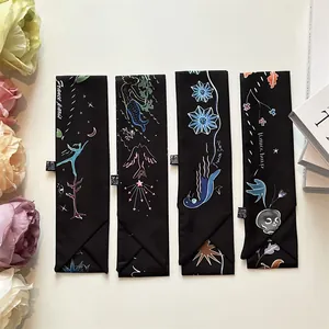 Elegant black silk twilly scarves with artistic mermaid and floral prints for handbags