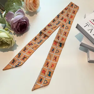 Orange silk twilly with equestrian horse motifs and white grid patterns for bags