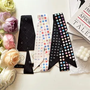 Elegant skinny silk scarf with geometric patterns and floral decorative accents