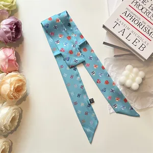 Light blue silk scarf with colorful chain patterns and elegant lifestyle accessories
