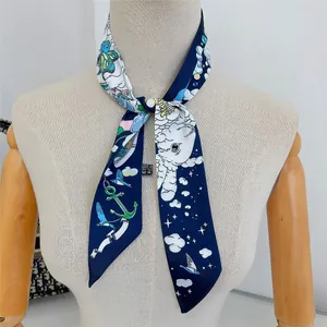 Detail of nautical print silk scarf with anchors and birds tied on a mannequin neck