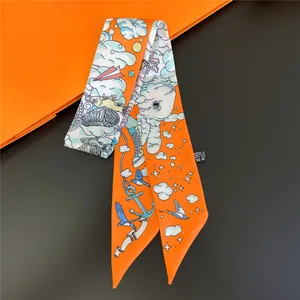Narrow silk twilly scarf in vibrant orange with cartoon bird and anchor illustrations