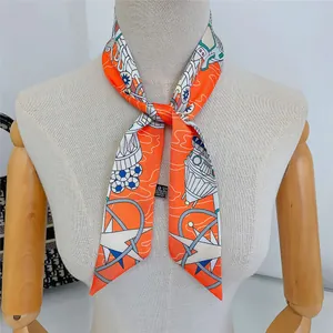 Detail of nautical print silk scarf with stars and sailboats tied on a mannequin neck