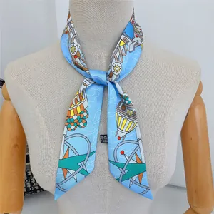 Close-up of light blue nautical silk twilly scarf tied on a mannequin neck for styling