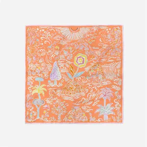 Macro view of square silk scarf featuring colorful hand-drawn landscape and sun patterns