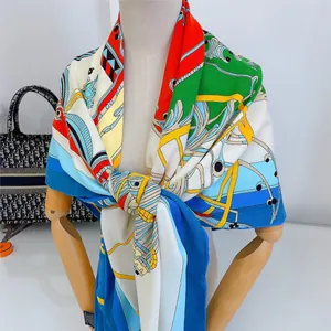 Vibrant multi-color patchwork silk scarf with hand-rolled edges on mannequin