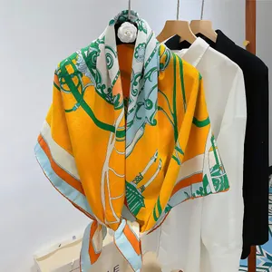 Detailed texture of silk wool scarf with vintage floral patterns in orange and green