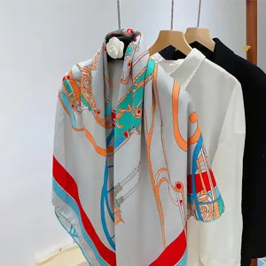 Detailed close-up of luxury silk wool scarf featuring colorful chain and geometric patterns