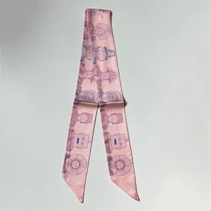 Pink silk-like twilly scarf with cartoon Egyptian motifs and floral prints on gray base