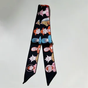 Black silk-style twilly scarf with cartoon illustrations and asymmetric diagonal ends