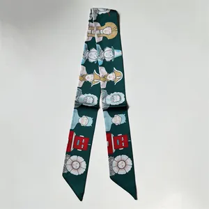 Artistic dark green silk-like twilly scarf featuring Egyptian and robot illustrations