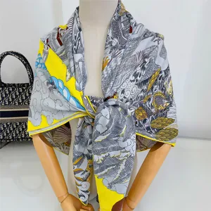 Detailed view of luxury silk scarf with nautical sailboat illustrations and classical prints