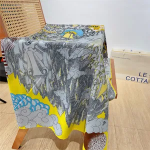 Close-up of thick cashmere-like scarf with artistic landscape print on a wooden chair