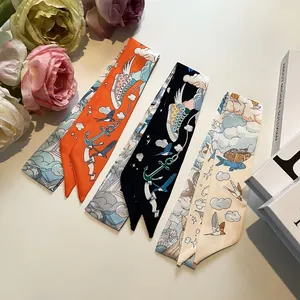 Three elegant patterned twilly scarves in orange, black and cream with creative illustrations