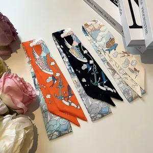 Three elegant patterned silk scarves in orange, black, and white for bags and neck