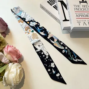 Elegant skinny silk scarf with fairytale prints tied on a bag handle among flowers
