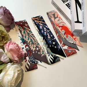 Narrow silk scarves with Maya jungle patterns for handbag handles and neck styling