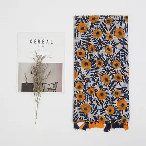 Bohemian floral cotton linen scarf with orange flower patterns and tassel edge details