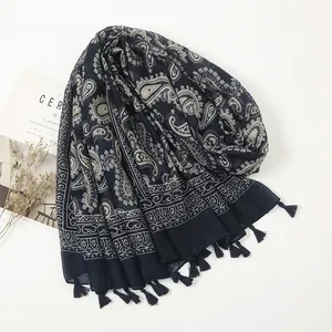 Ethnic navy blue paisley cotton shawl with tassel fringe and minimalist lifestyle decor